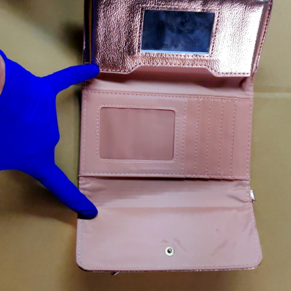 Beautiful rose gold cell phone purse case.